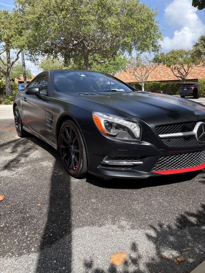 Black AMG Mercedes SL with red accents &mdash; detailed by Dany