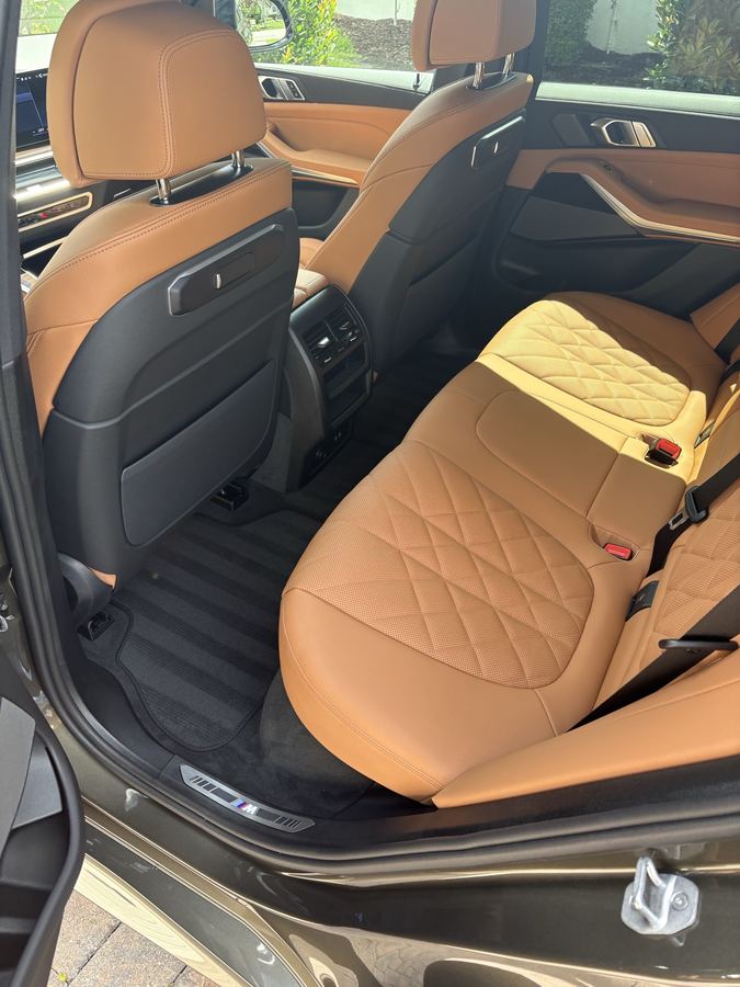 BMW interior — cognac diamond-stitched rear seats