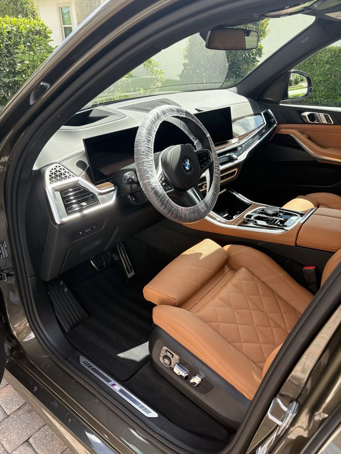BMW interior — cognac diamond-stitched leather, full detail