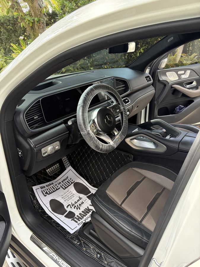 AMG GLE cockpit after an interior detail, quilted mats and protected steering wheel