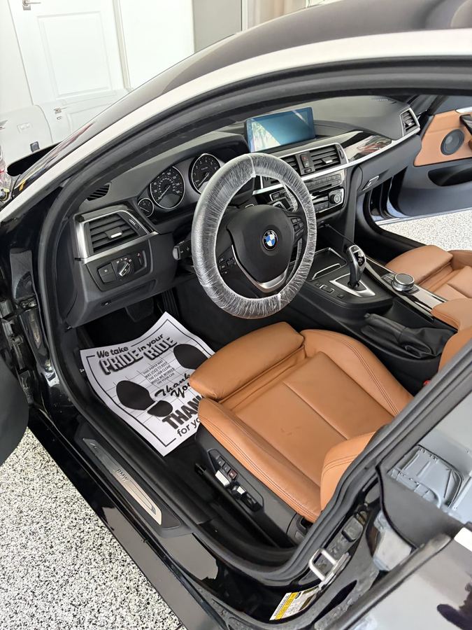BMW cabin with saddle leather seats after a full interior detail