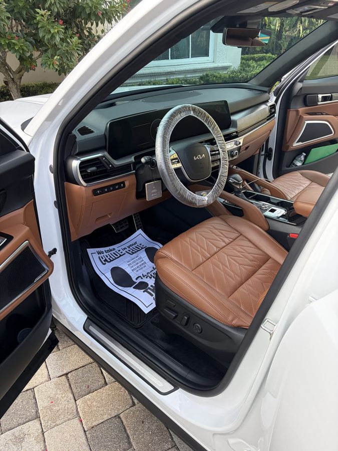Kia Telluride interior with saddle leather seats after a full detail